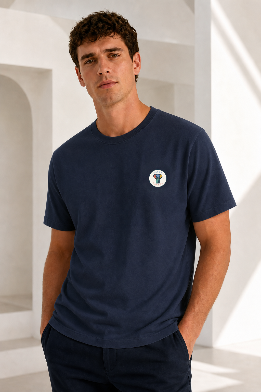 Male model wearing the Santi Harper Full Colour Compact Badge T-shirt in French Navy